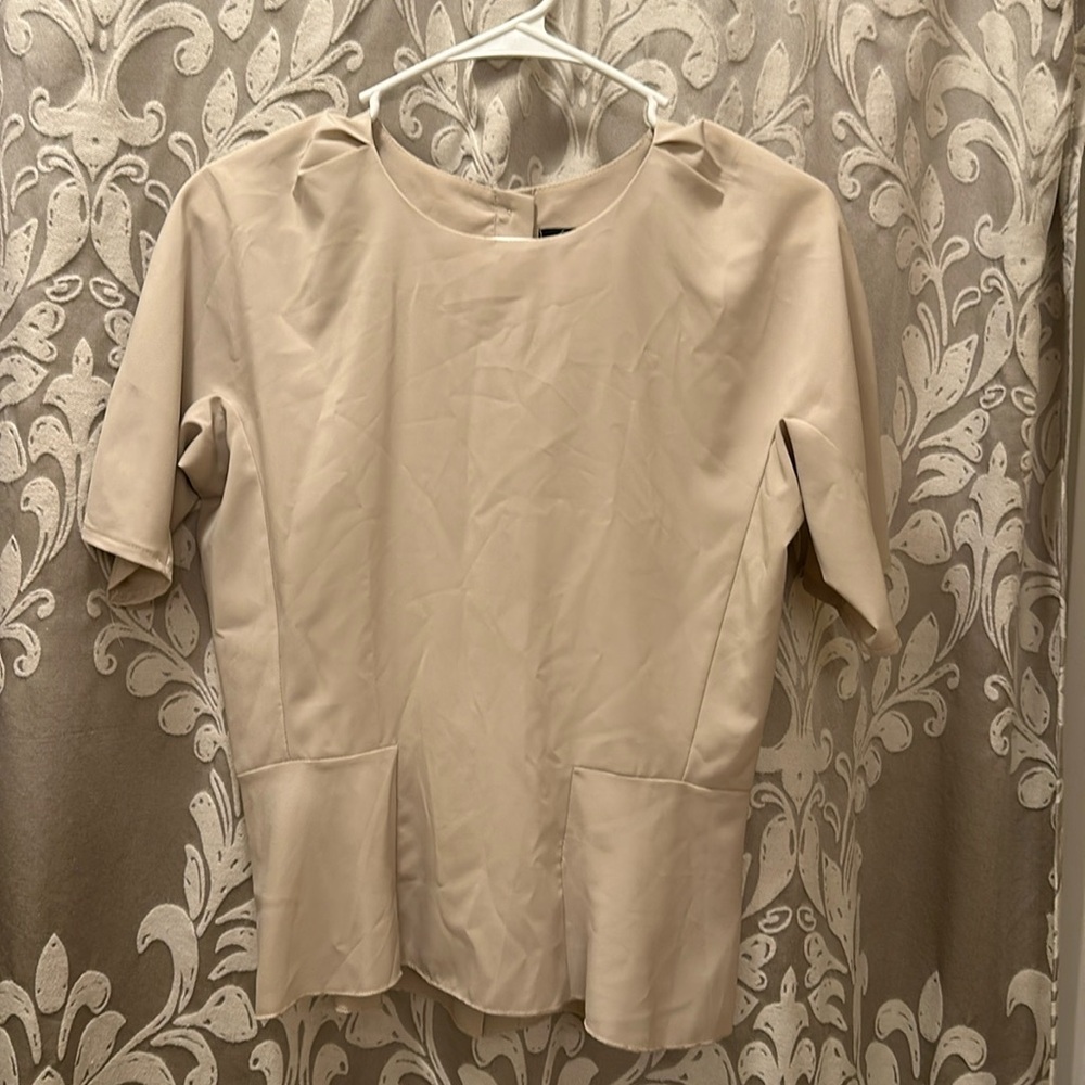 Foreign Exchange beige peplum top.